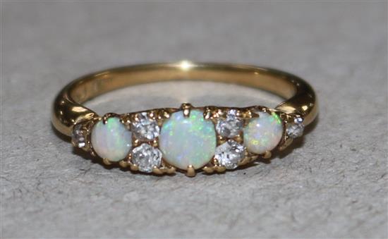 A gold, white opal and diamond dress ring, size L.